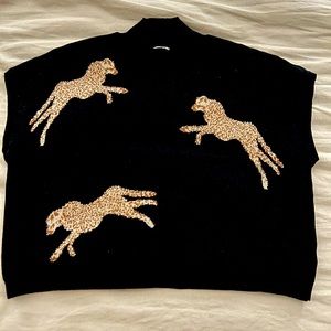 Stylish boutique crop sweater. No tags but never worn.